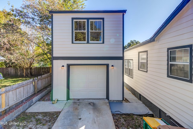 garage featuring wooden walls