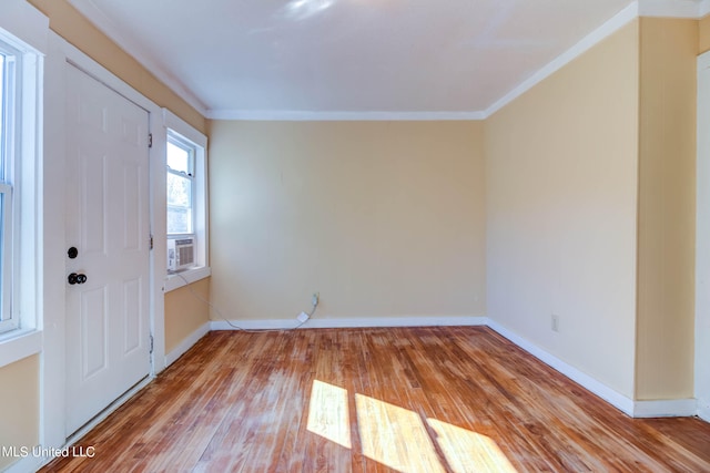 entryway featuring ornamental molding and light wood-type flooring