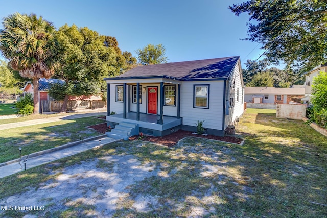258 Porter Ave, Biloxi, MS 39530 - bungalow-style home featuring a porch, crawl space, a front lawn, and fence