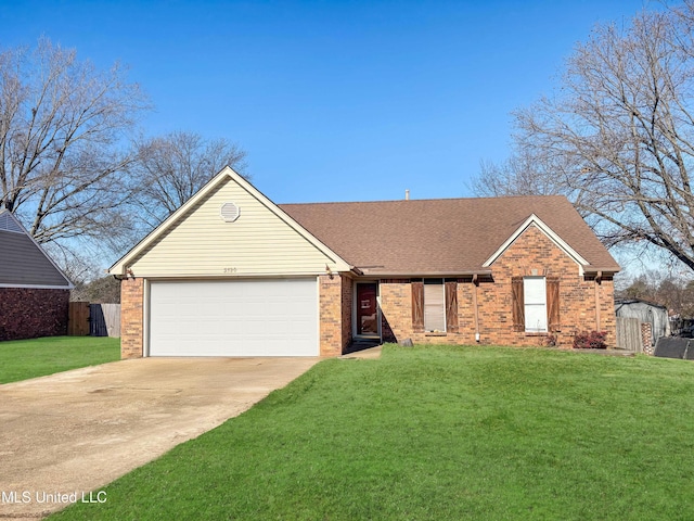 ranch-style house featuring a front yard and a garage