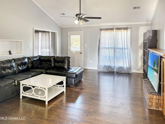 living room with ceiling fan, vaulted ceiling, dark hardwood / wood-style flooring, and ornamental molding