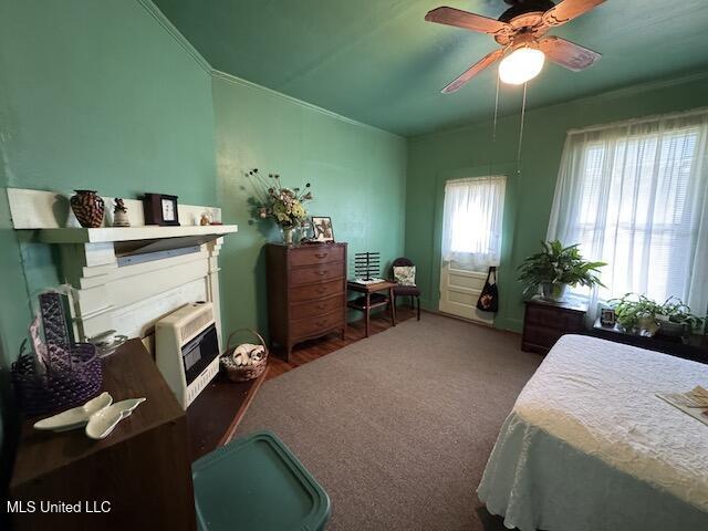 bedroom featuring ceiling fan and dark carpet