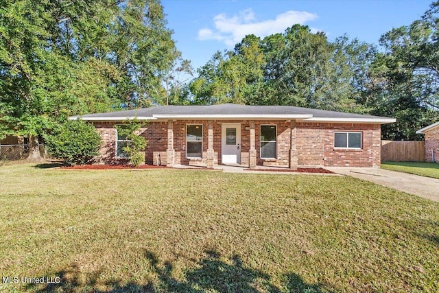 ranch-style home with a front lawn