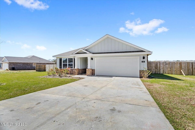 view of front of home featuring brick siding, board and batten siding, fence, a front yard, and an attached garage