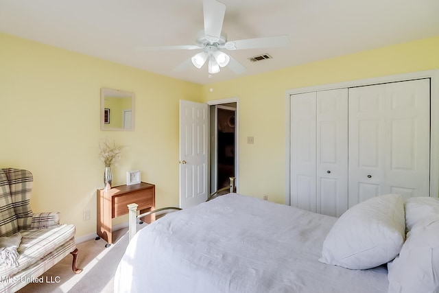 bedroom featuring carpet, a closet, visible vents, ceiling fan, and baseboards