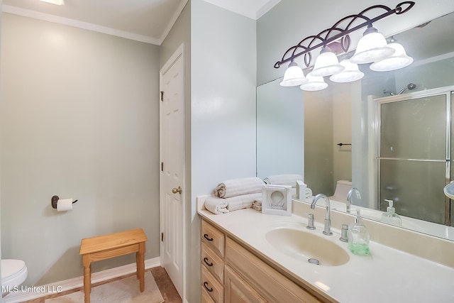 full bathroom with toilet, crown molding, vanity, a shower stall, and a closet