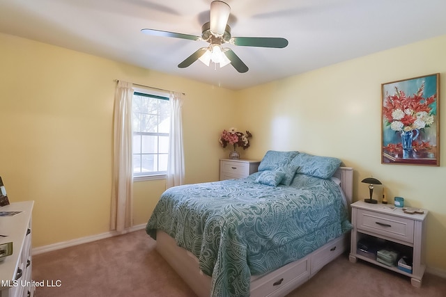 bedroom with baseboards, ceiling fan, and light colored carpet