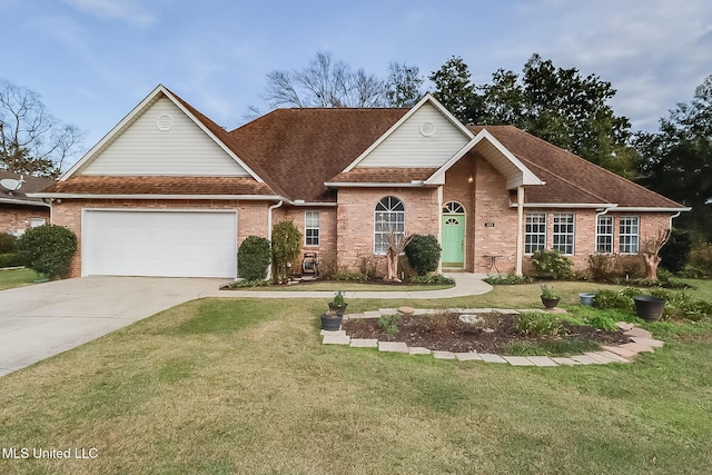 view of front of house featuring a front yard, concrete driveway, and brick siding