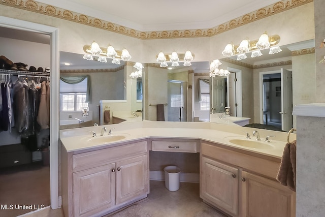 full bath featuring a walk in closet, crown molding, and vanity