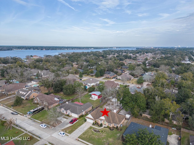 drone / aerial view featuring a water view and a residential view