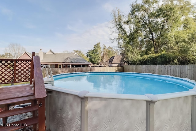 view of pool featuring a fenced in pool and fence