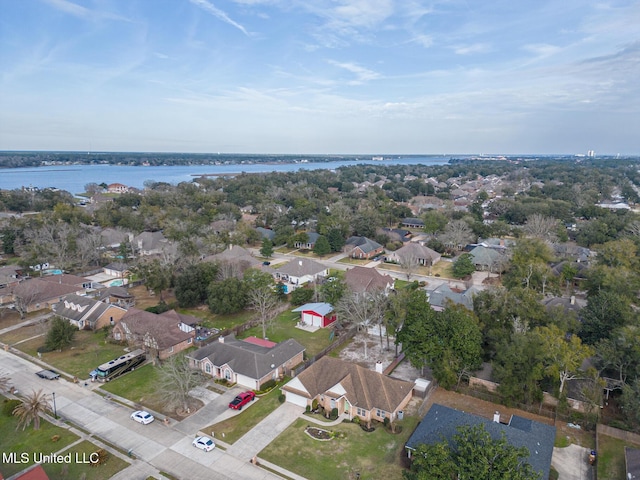 drone / aerial view featuring a water view and a residential view