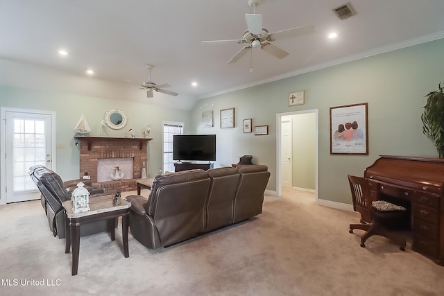 living area featuring a brick fireplace, visible vents, ornamental molding, and light colored carpet