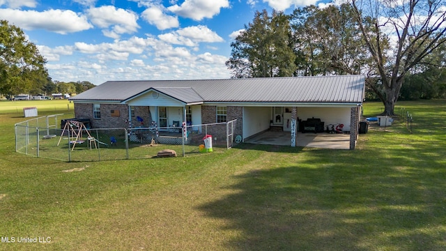 back of house featuring a yard