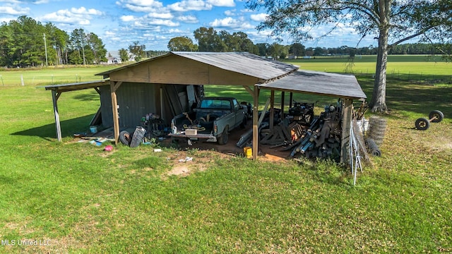 view of outbuilding featuring a yard