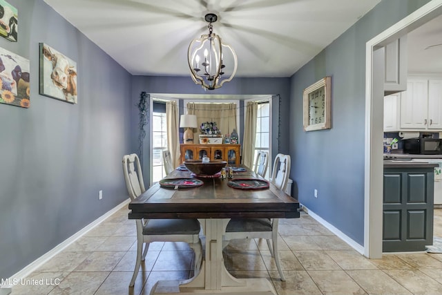 dining space featuring an inviting chandelier