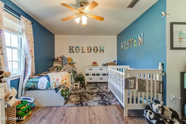 bedroom featuring ceiling fan and wood-type flooring