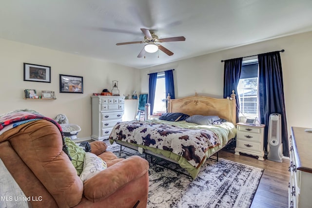 bedroom featuring ceiling fan and hardwood / wood-style floors