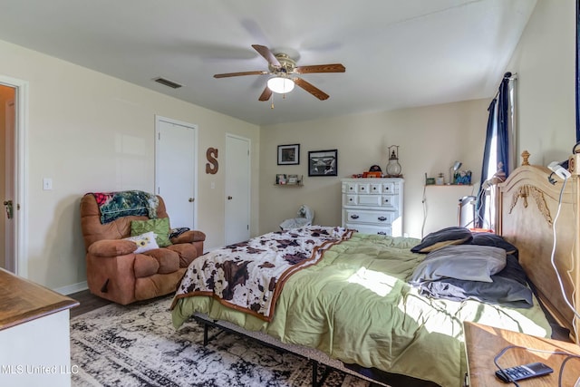 bedroom featuring ceiling fan and wood-type flooring