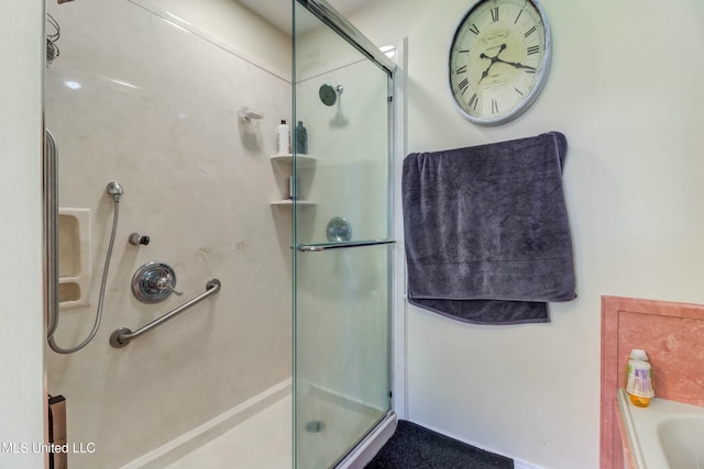 bathroom featuring separate shower and tub