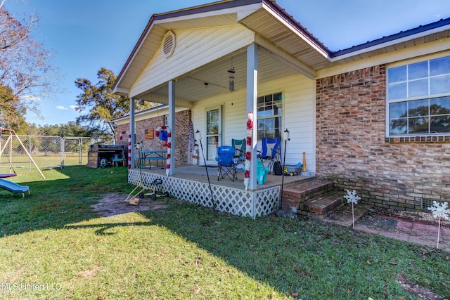 exterior space featuring a lawn and a porch