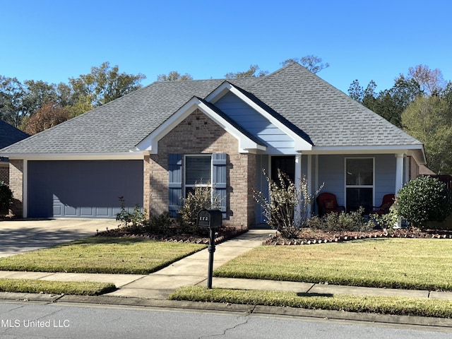 view of front of house with a garage and a front yard