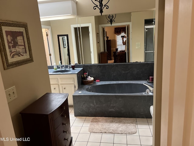 420 Fox Bay Dr, Brandon, MS 39047 - full bathroom featuring a garden tub, tile patterned flooring, vanity, and a shower with shower door