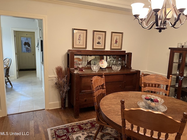 420 Fox Bay Dr, Brandon, MS 39047 - dining area with a chandelier, baseboards, ornamental molding, and wood finished floors