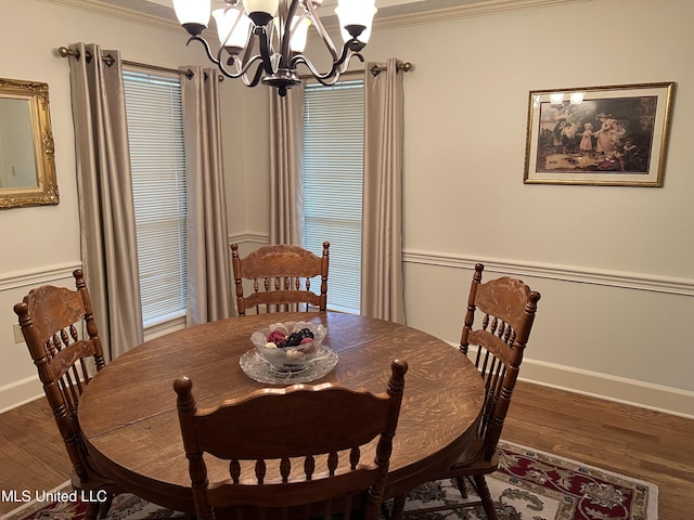 420 Fox Bay Dr, Brandon, MS 39047 - dining room featuring a chandelier, wood finished floors, crown molding, and baseboards