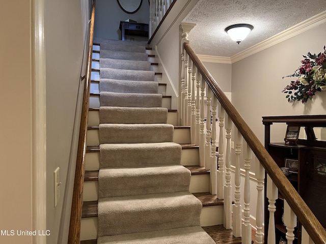 420 Fox Bay Dr, Brandon, MS 39047 - staircase with ornamental molding, a textured ceiling, and wood finished floors