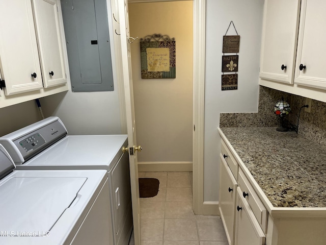 420 Fox Bay Dr, Brandon, MS 39047 - washroom featuring electric panel, cabinet space, washing machine and clothes dryer, light tile patterned floors, and baseboards