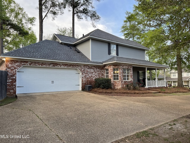420 Fox Bay Dr, Brandon, MS 39047 - view of front of home featuring driveway, a porch, a shingled roof, brick siding, and a garage