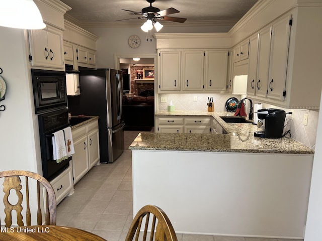 420 Fox Bay Dr, Brandon, MS 39047 - kitchen featuring black appliances, a sink, ceiling fan, tasteful backsplash, and a peninsula