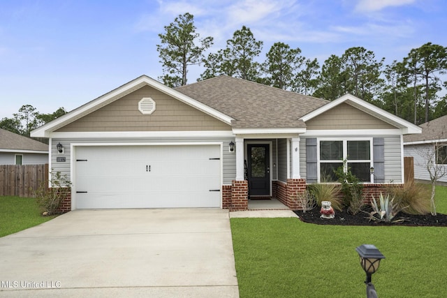 view of front of home with a garage, brick siding, a shingled roof, driveway, and a front lawn