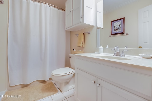 bathroom with tile patterned flooring, vanity, and toilet