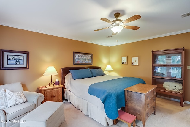 bedroom featuring ceiling fan, ornamental molding, and light carpet