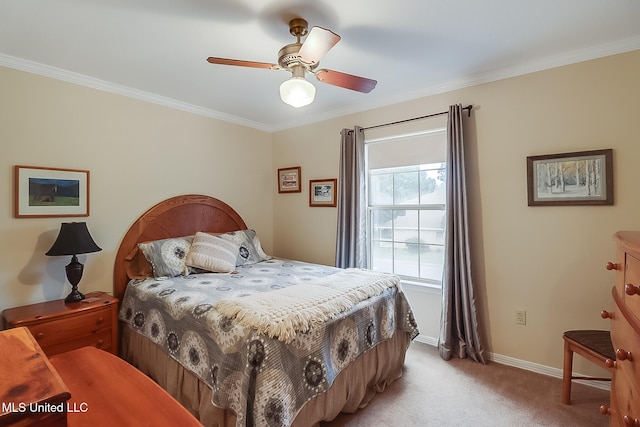 carpeted bedroom with ceiling fan and ornamental molding