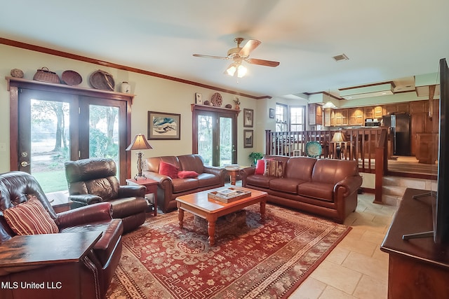 living room with ceiling fan, french doors, and ornamental molding