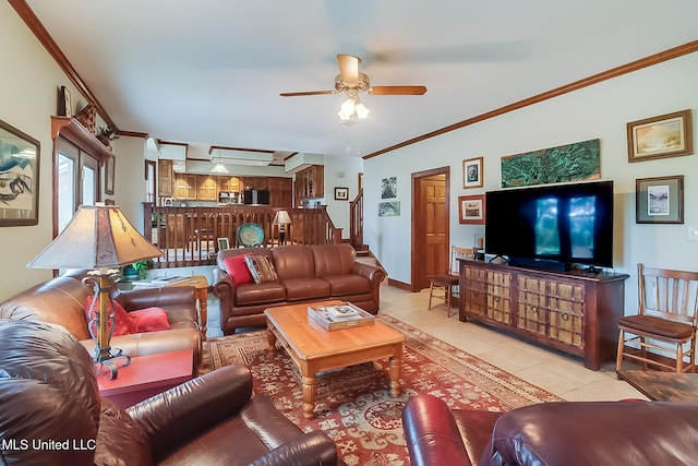 living room with crown molding, light tile patterned floors, and ceiling fan