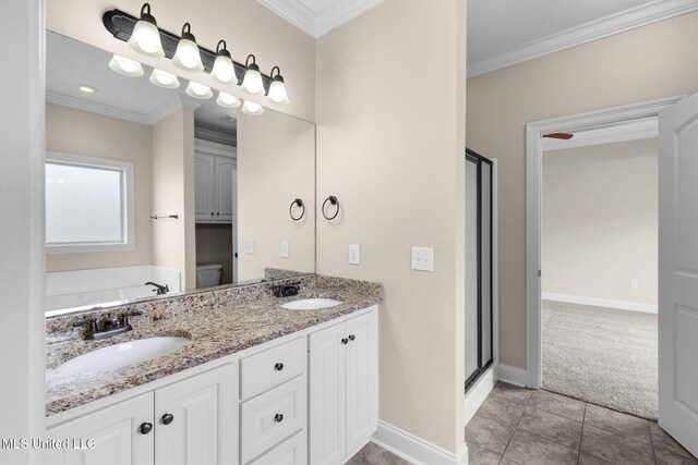 bathroom featuring ornamental molding, a sink, and toilet