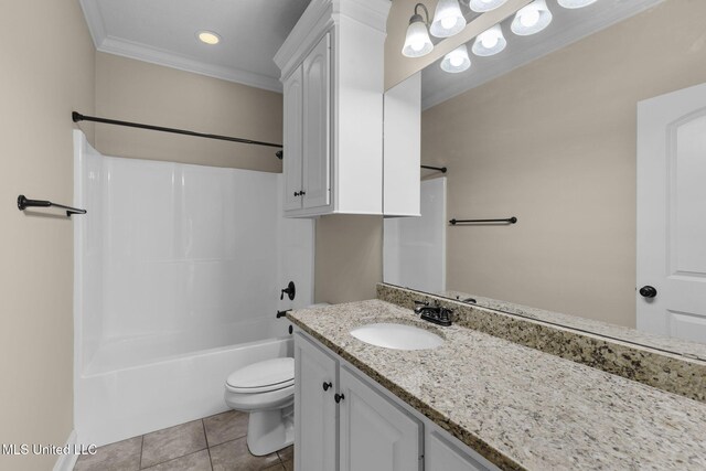 bathroom featuring toilet, vanity, ornamental molding, tile patterned floors, and washtub / shower combination