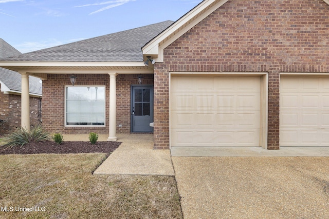 ranch-style house with brick siding, roof with shingles, and an attached garage