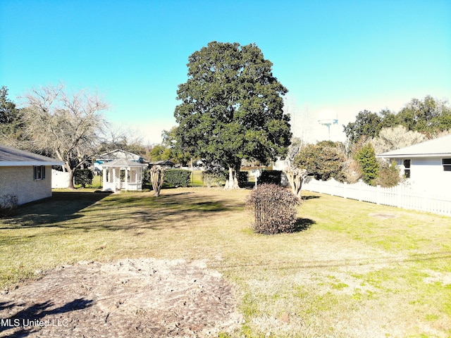 view of yard with a gazebo and fence