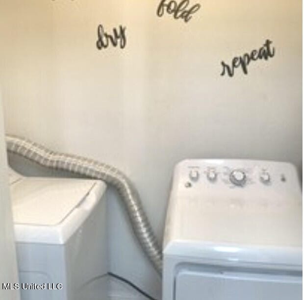 laundry room with separate washer and dryer