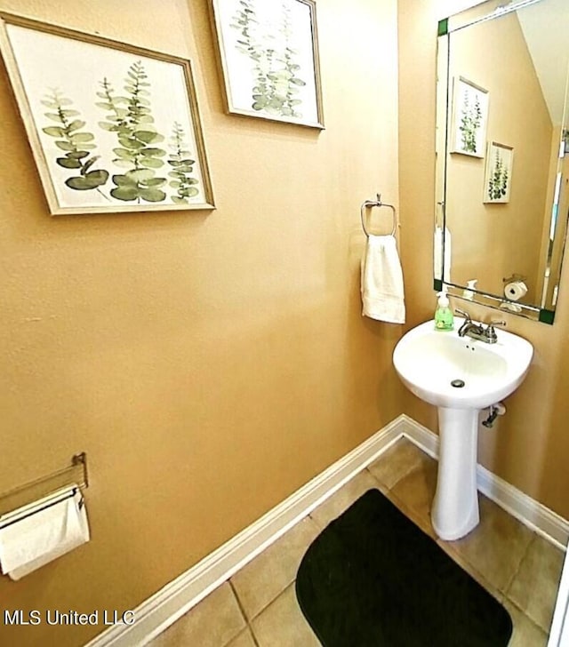 bathroom with tile patterned floors