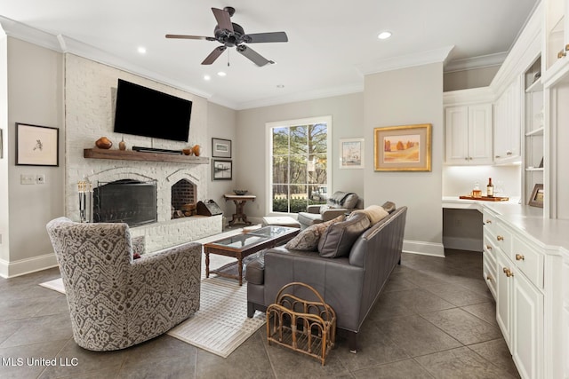 living area featuring recessed lighting, a fireplace, baseboards, built in desk, and crown molding