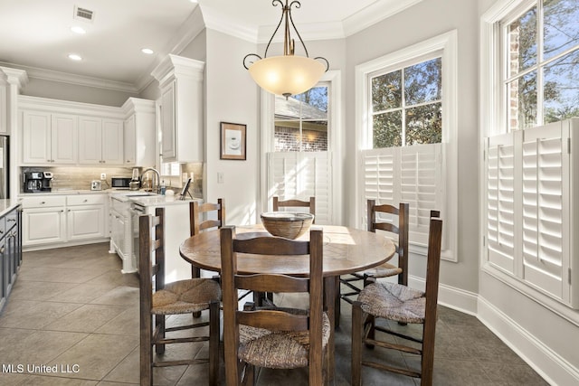 dining room featuring recessed lighting, visible vents, ornamental molding, dark tile patterned flooring, and baseboards