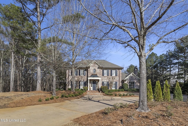 view of front of home with brick siding