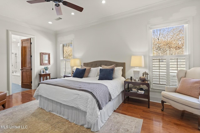 bedroom featuring ornamental molding, wood finished floors, visible vents, and recessed lighting