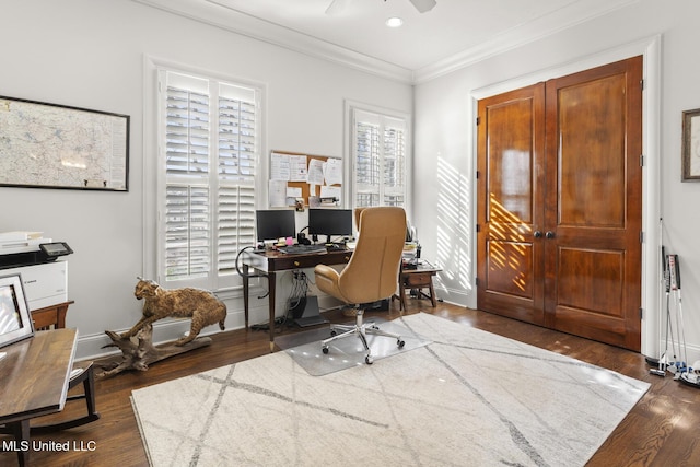 office featuring dark wood-style floors, crown molding, baseboards, and ceiling fan